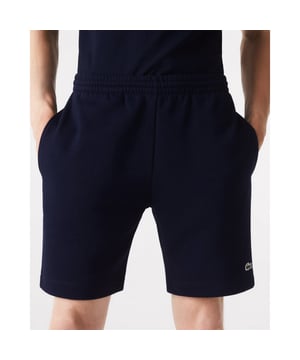 PRODUCT REF. GH9627-00 Efficient. Durable. Comfortable. An iconic, performance-enhancing essential that's comfortable enough to relax in. Regular fit, straight cut: Unrestricted freedom of movement. Drawstring waist: An adjustable waistband for optimum comfort. Back pocket with piping: Practical and functional. Embroidered crocodile on the front: Lacoste-typical performance. Brushed organic cotton fleece: Long-lasting comfort during sports. Main material: cotton (84%), polyester (16%) / pocket lining: cotton (100%)