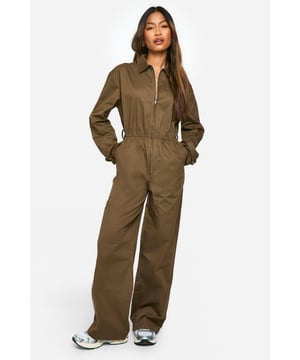 Versatile utility-inspired jumpsuit with front zip closure
        Collared neckline for a structured look
        Elasticated waist for a flattering silhouette
        Functional cargo pockets for added practicality
        Wide-leg design for comfort and style
    
    Make a statement in this eye-catching cargo utility jumpsuit from Boohoo. Perfect for the fashion-forward woman who values both style and functionality, this piece combines trendy utility elements with a chic silhouette. The front zip closure allows for easy wear, while the elasticated waist creates a flattering shape. Style it with trainers and a crossbody bag for a casual daytime look, or dress it up with heeled boots and statement jewellery for an evening out. The wide-leg design offers comfort and movement, making it ideal for various casual occasions, from family gatherings to weekend brunches. Layer with a leather jacket for cooler days or wear it on its own when the temperature rises. This versatile jumpsuit is a must-have addition to any contemporary wardrobe, offering endless styling possibilities for the modern British woman.
