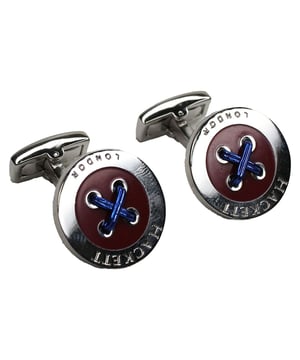 Hackett London 4 Button Hole Men's Red Cufflinks – an exquisite accessory that adds a touch of refinement and sophistication to your formal attire. These cufflinks showcase Hackett London's commitment to quality craftsmanship and attention to detail. Here are the key features of these distinguished cufflinks:

 Premium Quality:  Crafted with precision and care, these cufflinks are made from high-quality materials, ensuring durability and a luxurious appearance. Hackett London is renowned for its dedication to quality craftsmanship.

 Elegant 4 Button Hole Design:  These cufflinks feature a unique and eye-catching design with four buttonholes arranged in a square pattern. This design adds an element of individuality and distinctiveness to your formal ensemble.

 Classic Red Color:  The red color of the cufflinks is bold and attention-grabbing. Red is often associated with confidence and sophistication, making these cufflinks a statement accessory for special occasions.

 Easy Application:  The cufflinks come with a simple and secure fastening mechanism, allowing you to easily attach and remove them from your shirt cuffs. They are designed for convenience and ease of use.

 Versatile Styling:  These cufflinks are versatile and can be worn with a range of dress shirts and suits. They add a pop of color and a touch of personality to your outfit, making them suitable for weddings, formal events, and business meetings.

 Durable Construction:  Hackett London's commitment to quality ensures that these cufflinks are built to last. They are designed to withstand regular use without losing their shine or charm.

 Iconic Hackett London Branding:  The cufflinks may feature discreet branding, such as the Hackett London logo or name, adding an element of exclusivity and authenticity to your formal attire.