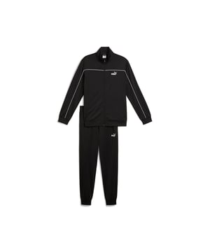PRODUCT STORY: These everyday essentials feature a high-collar jacket with rib cuffs and waistband, plus pants with an elastic waistband and internal drawcord for customized comfort. PUMA No. 1 Logo rubber prints and piping details complete the look. FEATURES & BENEFITS: Made with at least 90% recycled materials. DETAILS: Regular fit; High-collar; Elastic waistband with internal drawcord; Ribbed cuffs; Closed bottom; PUMA branding details; 100% polyester Recycled - tricot - 220.00 g/m - piece dyed - Mechanical - Brushing, Mechanical - UPFMain Material 3: 100% polyester Recycled - tricot - 220.00 g/m - piece dyed - Mechanical - Brushing, Mechanical - UPF.  Our model is 180 cm tall and is wearing size M UK.