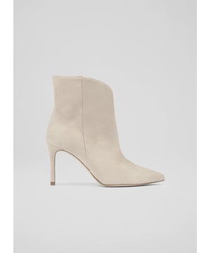 The Taytum ankle boots are crafted in Spain from desert suede. These pull-on boots have a pointed toe, a V-front and curvaceous cut, side seam detail and an 80mm straight stiletto heel.