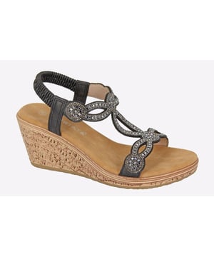 Elevate your footwear collection with these stunning wedged sandals that effortlessly fuse style and comfort. 
 Crafted with a synthetic upper embellished in jewels, these Ora Cipriata Sandals deliver a holiday aesthetic and bring a touch of glamour to your outfits. 
 These sandals feature a plush PU lining with the padded microfiber sock providing soft cushioning with every step, ensuring all-day comfort, while the elasticated sling-back design offers a sung fit.
 Completed with a durable cork wedge outsole, these sandals are bound to turn heads, whether you're strolling along the beach or stepping out for a night on the town. 
 - Synthetic upper 
 - PU lining 
 - Padded micro fibre sock 
 - Jewelled embellishments 
 - Elasticated sling back design 
 - Durable cork wedge outsole