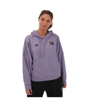 Womens adidas Olymipique Lyonnais Hoody in lilac.- Drawcord-adjustable hood.- Kangaroo pockets.- Ribbed cuffs and hem.- Olympique Lyonnais woven crest.- Regular fit.- Main Material: 70% Cotton  30% Polyester (Recycled). Hood Lining: 100% Cotton.- Ref: IC9624