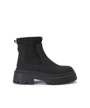 The Thea2 is a black boot with chunky style, there is a stretch ankle for slip-on ease. The sole is extra chunky with large tread. The back of the ankle features a brown monocle and KG Kurt Geiger branded tape.