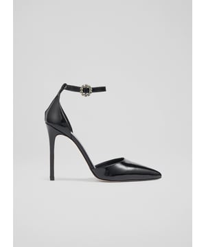A glamorous pair of heels in our new collection, the Kiera ankle strap shoes are perfect for the party season. Crafted in Spain from beautiful glossy black patent leather, they have a pointed toe, an open cut with an ankle strap, diamante round buckle detail and a 110mm stiletto heel. Wear them with a sleek tuxedo or your favourite party dress.