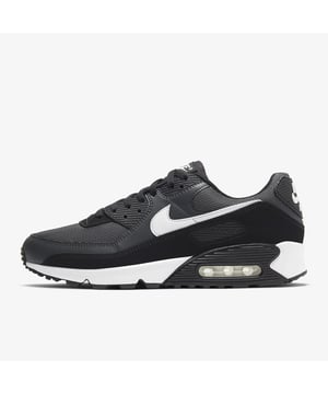 Crafted with comfortable and stylish features, the Nike Air Max 90 Grey white smoke grey may just be your next essential piece. - -. This monochromatic pair has a mostly grey upper that consists of a breathable mesh base and leather overlays. - -.  Hints of white come via the Nike Swoosh outline and the “AIR MAX” branding near the rear. - -.  Comfort-wise, this Nike Air Max 90 has a padded tongue and a lace closure to ensure a snug fit. - -.  Underfoot, it rounds off with a dark grey midsole that houses a visible Nike Air cushioning.
