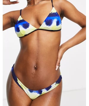 Bikini briefs by Superdry. Tie-dye design, low rise and brief cut.