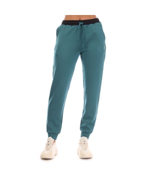 Dames Skins Series-3 Warm Up Broek in groenblauw.- Elastische tailleband.- Open zakken.- Zijzak met rits.- Elastische manchetten.- Zilveren reflecterende logo's.- 89% Polyester 11% Elastane.- Ref: ST40731000535