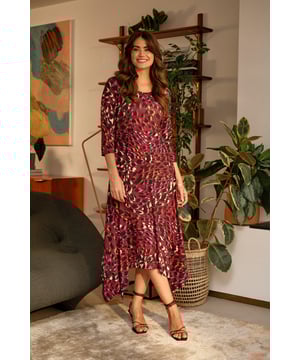 Add a vibrant animal print to your new season closet with this anima print midi dress. With a round neck, 3/4 sleeves, a hanky hem and a midi skirt. Style with strappy hees for a special event or pair with tights and block heeled boots to beat the chill.