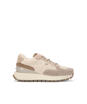 This KG Kurt Geiger Louisa Warm sneaker has a faux borg fur upper in taupe tones. There is gold tone branding across the upper in studs and eyelets. The tongue also features gold foil embossed branding.