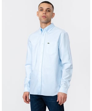 This gorgeous take on a menswear classic is a great addition to your everyday wardrobe. Dress it up with chinos or down with jeans: step out in Lacoste croco-style!

Organic cotton
Regular fit, straight cut
Lacoste engraved polyester buttons
2 pleats on back for added comfort
Classic embroidered crocodile on pocket
Cotton (100%)

CH1911
&nbsp;