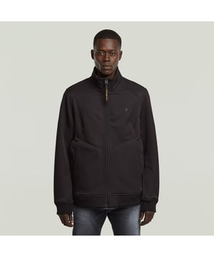 Raised collar. Zipper closure. Waist pockets, snap button closure. Ribbed cuffs. Shoulder panel. Zip closure. Track jacket Softshell is a comfortable zip through style. Pockets at the waist offer a snap button closure. The sleeves and waist are finished with a ribbed edge, alike the collar. Outer layer: 92% Recycled polyester, 8% ElastaneInner layer: 100% Recycled polyester. Comfortable stretch. Straight