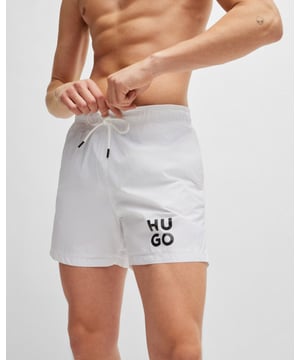Sleek quick-drying swim shorts by HUGO Menswear. Featuring full lining and a drawcord waist, this pair is printed with a stacked HUGO logo. This product is created with recycled polyamide made from pre- and post-consumer textile waste or industrial fishing nets.
Material information: 100% Polyamid, Lining: 100% Polyester, Inner lining: 100% Polyester
50510190