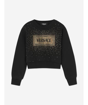 Versace envision bold, innovative abstracts in their beautifully crafted aesthetics. This girls black cropped sweatshirt encapsulates the Italian label's passion for daring and unparalleled technology. Envisioned in soft cotton jersey with a 90s-inspired vintage Versace logo embellished with crystals and studs on the front.  Made in Italy Brushed Cotton Long Sleeves Ribbed Crew Neck, Cuffs and Hem 100% Cotton