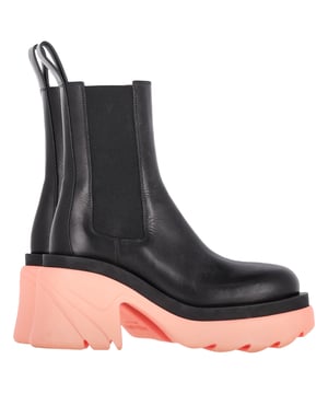 VINTAGE, RRP AS NEW
The Bottega Veneta Flash Platform Ankle Boot in Black Leather and Pink Rubber Sole is a striking statement piece that merges classic craftsmanship with modern flair. The sleek black leather upper provides a timeless and sophisticated aesthetic, while the vibrant pink rubber sole adds a playful twist, making these boots stand out. The platform design offers both height and comfort, ensuring you look stylish without sacrificing wearability.

Styling Tip: Pair these boots with a tailored black leather jacket and skinny jeans for a bold, high-fashion look. For a more casual yet edgy style, combine them with an oversized hoodie and leggings, allowing the pink sole to pop. A simple black crossbody bag will keep the focus on the boots.

Bottega Veneta Flash Platform Ankle Boot in Black Leather and Pink Rubber Sole
Condition: Very good
Signs of wear: Include Box., Minor markings, Lightly used but very well maintained. Minor mark at soles & creasing, light scuffing at the soles and heels.
Packaging: Box, Dust bag
Color: Brown | ochre
Material: Leather | leather
Size: EU | 37.5/FR37.5/IT37.5/UK4.5/US7.5
Measurements: Heel height: 90; Insole length: 290
SKU: NAPPUGBSH431369W