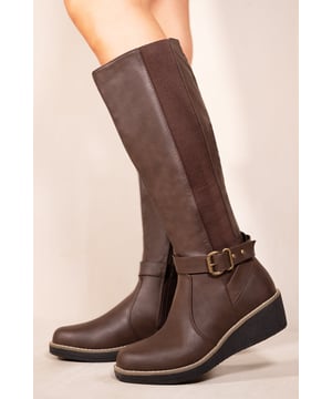This boot is a must-have for those who want to make a statement. These boots feature wedge heel and elastic panel which makes its design beautiful and easy to pair with any outfit. These boots are ideal if you want to look stylish this winter season and make you feel confident and sexy as you walk down the street.