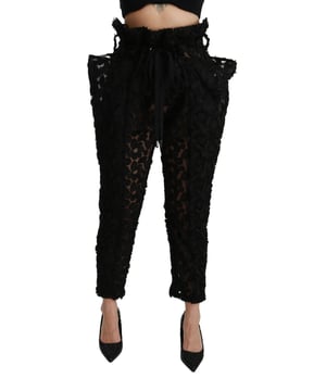 Marca: Dolce & Gabbana  
Modelo: Pantalones de alta cintura ajustados  
Ajuste: Regular  
Material: 100% Poliéster  
Color: Encaje Negro  
Cierre: Cintura elástica  
Detalles del logo  
Hecho en Italia  
Material: 100% Poliéster  