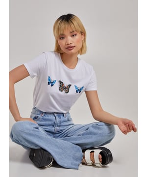 The noughties style is back! Be the social butterfly you are with this statement tee. 65% Polyester, 35% Cotton. Made in China. Hand Wash. Dry Flat. Do Not Iron. Model wearing size S. Model height: 5'9"/ 175cm