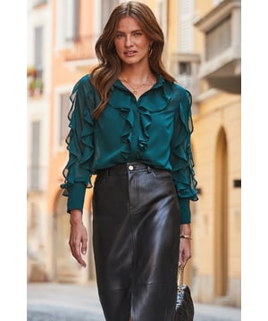 Guaranteed to spark joy Statement ruffles make it so fun to wear Cut for a comfy relaxed fit It'll take you from desk to dinner We love it with kick-flare trousers or jeans Dial up the glamour with jewelled earrings