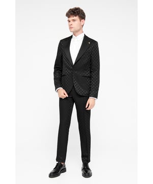 This wardrobe winner is cut to a slim fit, we recommend choosing your usual size.
After a fail-safe suave 2-piece suit? The Papatya from Twisted Tailor will deliver. Crafted from a black jacquard print, this suit offers an expensive look without the huge price tag.
The trousers feature a flat front with contrast piping on the slanted pockets. Style the trousers with the matching suit jacket to complete the full look.