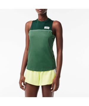 Women's Lacoste Sport Contrast Stretch Cotton Sport Tank.- Designed for tennis, with an intensive frequency, this product is providing you Ultra Dry technology which guarantees you to keep you dry even during practice. It has been tested by athletes to ensure functionality.- Stretch cotton.- Slim, fitted cut.- Quick drying.- Silicone crocodile on front.- 100% Cotton. Machine washable. Ref: TF1010PIV.