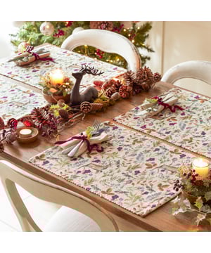 A wonderfully festive set of four placemats which features charming Reindeers who stand proudly amongst the vivid seasonal florals. Digitally printed for exceptional clarity on a durable woven polyester fabric, these beautifully designed table placemats will instantly transform your Christmas dining table.