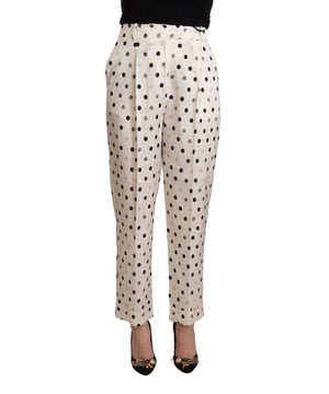 Marca: ERMANNO SCERVINO  
Modelo: Pantalones de tiro alto ajustados  
Color: Blanco con lunares  
Cierre con cremallera y botón  
Detalles del logo  
Material: 97% Viscosa 3% Elastano  
Calidad y artesanía  
Diseño versátil y elegante  
Tiro alto favorecedor y ajuste tapered  
Material: 97% Viscosa 3% Elastano