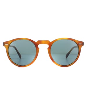 Oliver Peoples Gregory Peck OV5217S 1483R8 Semi Mate LBR Indigo Photochromic Sonnenbrille ist eine weitere von Prominenten inspirierte Sonnenbrille von Oliver Peoples mit diesen unglaublichen Schattierungen von Retro-Stil mit einem ikonischen Design und Stil der coolen Metallbrücke.