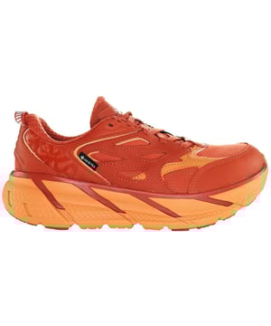 Hoka Clifton L Gore-Tex Men's Orange Trainers, a cutting-edge fusion of style, comfort, and performance designed to take your outdoor adventures to the next level. These remarkable sneakers are engineered with a host of key features that make them the ideal choice for athletes, outdoor enthusiasts, and anyone seeking an unparalleled combination of functionality and fashion.

Key Features:

 Gore-Tex Waterproofing:  The Hoka Clifton L boasts Gore-Tex technology, ensuring your feet stay dry even in the most challenging weather conditions. Rain, mud, and puddles are no match for these trainers, keeping your feet comfortably dry throughout your adventures.

 Exceptional Cushioning:  Hoka is renowned for its maximalist cushioning, and the Clifton L lives up to that reputation. With its thick, plush midsole, these trainers provide superb shock absorption, reducing the impact on your joints and promoting a comfortable stride.

 Lightweight Design:  Despite their generous cushioning, these trainers remain remarkably lightweight. This feature enhances your agility and minimizes fatigue, making them ideal for long runs or all-day wear.

 Versatile Traction:  The outsole of the Clifton L offers dependable traction on a variety of terrains. Whether you're running on the pavement, hiking rugged trails, or tackling wet surfaces, these trainers provide the grip you need for confident movement.

 Bold and Eye-Catching Design:  The vibrant orange color of the Clifton L adds a bold and stylish touch to your athletic wardrobe. The shoe's contemporary design ensures you'll stand out whether you're on the track or strolling through the city.

 Secure Fit:  These trainers feature a secure lacing system that allows you to customize the fit to your liking, ensuring stability and support during every step.

 Breathable Upper:  The upper is crafted from breathable materials that keep your feet cool and comfortable, even during intense workouts.

 Durable Construction:  Built to withstand the rigors of outdoor activities, the Clifton L is made from high-quality materials that ensure longevity, so you can enjoy these trainers for many adventures to come.

 Ideal for All-Weather Use:  Thanks to their Gore-Tex waterproofing and versatile design, these trainers are suitable for year-round use, whether it's a rainy autumn day or a sunny summer morning.

The Hoka Clifton L Gore-Tex Men's Orange Trainers are the perfect fusion of fashion-forward design and high-performance technology. Whether you're an avid runner, a casual hiker, or simply someone who appreciates comfort and style in their footwear, these trainers are sure to exceed your expectations, making every step you take a remarkable experience. Elevate your outdoor activities and stay ahead of the pack with these exceptional sneakers.