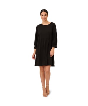 Beautiful for day or night, this shift dress is a timeless pick. This dress features a shift silhouette, long sleeves, and a circle neckline. Crafted from a soft rib-knit fabric, this long sleeve dress is a cozy style. A keyhole closure completes the design. Pair this dress with pumps for a night out or knee-high boots for an unforgettable look.