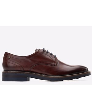 The Mawley Derby Shoe by Base London features a plain toe design, a refined 4-lace closure and high-quality leather uppers. The Ortholite insole ensures comfort, while contrast stitching around the rand adds a distinctive touch.- Classic design- Studded rubber sole- Ortholite insole