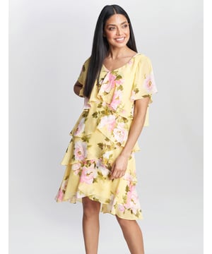 Our classic tiered dress in a fun yellow floral  print is a great addition to your wardrobe this season! Flattering and timeless this winning style is wearable for all special occasions, weddings and parties.