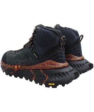 Prepare to conquer any trail with the Hoka One TenNine Hike Gore-Tex Unisex Navy Trainers. These high-performance hiking shoes are engineered for adventurers who demand durability, comfort, and protection in every step. Perfect for diverse terrains and varying weather conditions, the TenNine Hike Gore-Tex trainers are your ultimate outdoor companion. 
Key Features: 
- Waterproof Protection: 
Featuring a Gore-Tex membrane, these trainers provide superior waterproofing and breathability, ensuring your feet stay dry and comfortable in wet and challenging conditions. 
- Maximum Cushioning: 
The TenNine Hike incorporates Hokaâ€™s signature oversized midsole, delivering exceptional cushioning and shock absorption, ideal for long hikes and rugged terrains. 
- Extended Heel Geometry: 
Designed with an extended heel, these trainers offer enhanced stability and a smoother transition, reducing strain on your feet and joints during downhill treks. 
- Durable Construction: 
Built to withstand tough conditions, the TenNine Hike features a robust upper made from high-quality, abrasion-resistant materials, ensuring long-lasting durability and protection. 
- Advanced Traction: 
Equipped with a Vibram Megagrip outsole, these trainers provide superior traction and grip on various surfaces, from rocky trails to slippery slopes. 
- Supportive Fit: 
The trainers feature a secure lace-up closure, padded collar, and a supportive insole, providing a snug and comfortable fit that adapts to your footâ€™s natural shape. 
- Unisex Design: 
Designed to fit both men and women, these trainers offer a versatile fit and universal appeal, making them a great choice for any hiking enthusiast. 
Tackle any hike with confidence in the Hoka One TenNine Hike Gore-Tex Unisex Navy Trainers, where innovative design meets rugged durability, ensuring you stay comfortable and protected on every adventure.