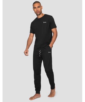 This loungewear set from Threadbare includes a short sleeve top with script embroidery and cuffed long bottoms with two side pockets. The bottoms have an elasticated waistband with drawstring for extra comfort. This set is perfect for lounging at home or bedtime. .