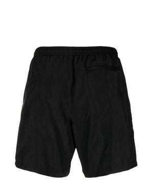 Instantly recognisable by the embroidered motif at the side, this pair of swim shorts from AMI Paris have a contemporary, minimalist style. Called 'ami de coeur', this detail symbolises playfulness and being carefree.