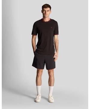 Finished with our signature Golden Eagle, these mesh-lined plain swim shorts, with fast-drying fabric, deliver the iconic Lyle &amp; Scott style both in and out of the pool.- Jet Black- 100% nylon- Elasticasted waist- 2-side pockets- 1-rear pocket with velcro fastening- Tonal woven drawcord- Tonal Lyle &amp; Scott logo