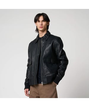 Men’s Barneys Originals goat leather bomber jacket. Features classic patch pockets, a Harrington-style collar, and knit rib detailing on the cuffs and hem for a timeless, structured fit.
