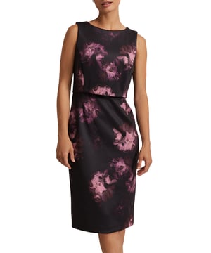 Embrace elegance with the Arianne Scuba Dress. Perfect for evenings, its fitted design flatters with a beautiful floral pattern.