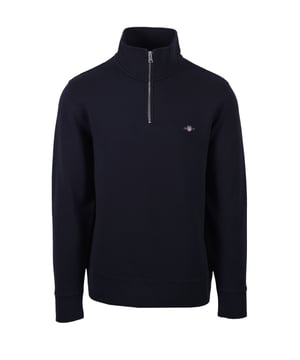 Gant Texture Half Zip Knitwear in Evening Blue
Experience timeless style with the Gant Texture Half Zip Knitwear. Crafted from a luxurious blend of lightweight cotton, this sweater offers exceptional comfort and a touch of sophistication. The all-over micro-textured design adds a subtle dimension, while the classic half-zip collar provides a versatile and stylish look.   
 
Key Features:

Classic half-zip collar for easy layering and adjustment   
Ribbed cuffs and hem for a secure and polished look   
Embroidered GANT archive shield graphic at the chest for a touch of heritage   
Lightweight and comfortable cotton blend for all-day wear   
Wash with similar colours
Material: 100% Cotton
