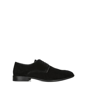 The KG Kurt Geiger Reuben is crafted from a black suede leather for breathability and comfort when worn over time. The front laces up with blind eyelets.