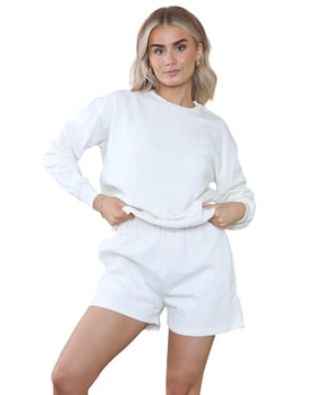 Introducing the Kruze Womens Tracksuit Set: a stylish and comfortable tracksuit set for women. The regular fit crew neck sweatshirt features ribbed waist and cuffs, while the soft fleece lining adds an extra layer of comfort. The accompanying shorts also feature a regular fit and an elasticated waistband with an adjustable drawstring for the perfect fit. Elevate your activewear game with this must-have set!