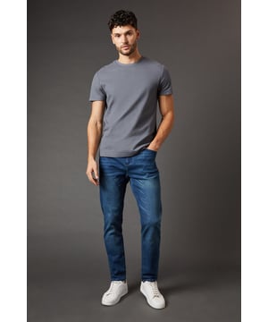 Tapered fit for a modern silhouette
        Classic five-pocket design
        Belt loops for versatile styling
        Subtle whiskering detail for a lived-in look
        Ankle-length cut perfect for showcasing footwear
    
    These Burton tapered fit jeans offer a perfect blend of comfort and style for the discerning gent. The tapered leg creates a sleek, contemporary profile that's ideal for both casual outings and smart-casual occasions. Pair them with a crisp white shirt and loafers for a pub lunch with mates, or dress them down with a favourite rugby shirt and trainers for a relaxed weekend look. The versatile design makes these jeans a wardrobe staple, easily transitioning from daytime errands to evening gatherings. The subtle whiskering adds character, while the classic five-pocket layout ensures practicality. Whether you're heading to a family barbecue or catching the match at your local, these jeans will keep you looking effortlessly stylish and feeling comfortable throughout the day.