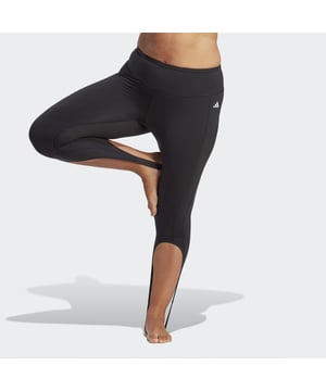 "This collection is all about owning your inner strength and finding your power within. I believe everyone has an inner superhero, and wearing this collection will inspire you to shine bright in every moment of your life" — Jessamyn Stanley.Created with Jessamyn — yogi, writer and advocate — the Collective Power Yoga Studio Leggings (Plus Size) are a bold take on traditional workout gear. Flow through your class with confidence thanks to a second-skin fit. A super high-rise waist helps to minimize distractions, supported by cool-to-the-touch fabric. Side perforations and stirrups provide a strong look from all angles.  - This model is 175 cm and wears a size 2X. Their chest measures 101 cm and the waist 91 cm. - Tight fit - Supportive waistband - 64% recycled nylon, 36% recycled elastane interlock - Sleek feel that moves with you - HEAT.RDY - Leg stirrups - Side perforations - Cool-touch fabric  Shipped by adidas