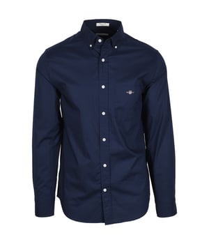 Gant Reg Poplin Shirt Marine
Crafted in a durable poplin fabric, this is an essential to elevate any wardrobe. Featuring an 80&rsquo;s inspired GANT shield logo embroidered at the chest pocket and a curved hem, this preppy classic can be worn with chinos and a nice shoe for an instant, no hassle, smart look.

Cotton 100%
Polin Fabric
Button down
Chest pocket
Embroidered logo
Style - 3000100
