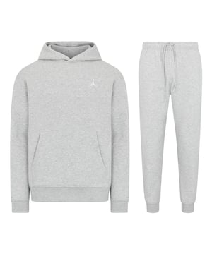 Stay cosy and stylish with this Jordan Fleece Tracksuit Set, combining a classic hoodie and joggers for all-day comfort. Crafted from soft brushed-back fleece, this set is smooth on the outside and plush on the inside, providing warmth and a premium feel. Perfect for casual wear or lounging, this tracksuit delivers timeless style with its simple design and iconic Jumpman logo. The hoodie features an adjustable hood and a spacious front pocket for convenience, while the joggers include an elastic waistband with a drawcord for a personalised fit and side pockets for small-item storage. The embroidered Jumpman logo adds a signature finish to both pieces, making this set a standout addition to your wardrobe. 
Key Features:
Material: 80% cotton/20% polyester fleece for warmth and comfort. 
Hoodie Design: Brushed-back fleece with a front pocket for practicality and embroidered Jumpman logo. 
Jogger Design: Elastic waistband with adjustable drawcord, side pockets, and embroidered Jumpman logo. 
Comfort: Soft fleece fabric with a smooth exterior and plush interior for all-day wear. 
Care Instructions: Machine washable for easy maintenance. 
Colour: Carbon Heather/White 
Style Code (Hoodie): FJ7774-091 
Style Code (Joggers): FJ7779-091 
This tracksuit combines iconic Jordan style with everyday functionality, making it perfect for any occasion.