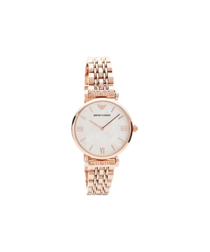 A very pretty Emporio Armani watch with rose tone styling throughout. The 32 x 6mm rounded rose tone case houses an unusual mother of pearl geometric dial and simple rose dial accents, whilst the attractive gate bracelet features adjustable links and a hidden folding clasp. Water resistant 30m. Band Material: Metal Bracelet Band Length: Mens Standard Movement Type: Quartz Case Colour: Rose Gold Tone Case Shape: Round Dial Colour: Mother of Pearl Display Type: Analogue Water Resistance: 30m Warranty Type: Manufacturer Warranty Description: 2 Years