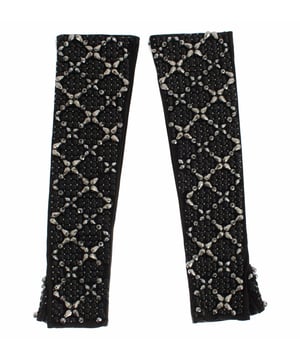 Gorgeous brand new with tags
  100% Authentic Dolce & Gabbana black leather
  Finger-free design
  Elbow length
  Black color with black and silver crystal beads
  Logo details
  Limited edition
  Made in Italy
Material: 100% Leather