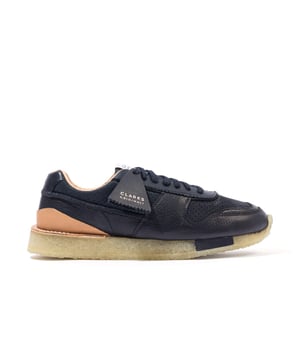 inchWith its FSC®-certified crepe sole  perforated upper and flexible EVA insert  retro-runner Tor Run champions considered design and next-level comfort. Here  our heritage-inspired sneaker is enhanced with a tactile black material mix and a veg tanned leather heel that ages beautifully over time. Slick style and feel-good wear  combined. -Premium perforated nubuck and leather upper -Heritage stitch-down construction  -Soft sheepskin lining -Natural  renewable  Forest Stewardship Council®-certified rubber crepe sole -Lightweight  flexible EVA insert in sole delivers next-level stability -Finished with two signature Clarks Originals fobs inch.