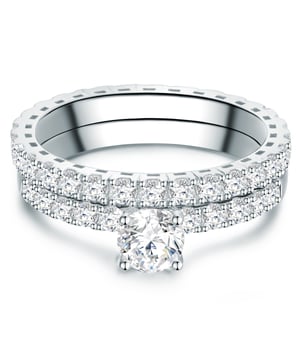 If you are looking for a very special accessory for engagement, this exclusive ring set will make the perfect decision. The engagement ring is half filled with zirconia crystals and is crowned by a solitaire in a recording. An enchanting addition is the fully occupied band ring, which can be worn both solo and as a pretense ring. A sparkling ring duo in which your loved one is guaranteed to fall in love immediately! The zirconia crystals in the elaborate brilliant cut are caught in filigree ring rails made of rhodium -plated sterling silver - an affordable alternative to expensive diamond rings.