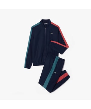 Heren Lacoste Sport Tennis Sportsuit - Colourblock - Gerecycled polyester gemaakt van snijresten uit de fabriek - Normaal recht model - Jasje gevoerd met mesh - Broek gevoerd met jersey - Siliconen krokodil op borst - Ref: WH8334-ISJ